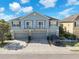 Two-story townhome with private garages, balconies, and a well-maintained exterior at 6851 Breezy Palm Dr, Riverview, FL 33578