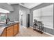 Kitchen view showcases an archway, wooden cabinets, and a cozy beverage station at 6851 Breezy Palm Dr, Riverview, FL 33578