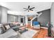 Spacious open-plan living area with hardwood floors and a comfortable seating arrangement at 6851 Breezy Palm Dr, Riverview, FL 33578