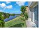 Scenic water view from the property with lush green landscaping and clear blue skies at 6851 Breezy Palm Dr, Riverview, FL 33578
