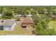 Aerial view of a two-story home with a large backyard surrounded by lush trees at 7102 W Creek Dr, Tampa, FL 33615