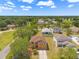 Aerial view of a home, showcasing the surrounding neighborhood and lush greenery at 7102 W Creek Dr, Tampa, FL 33615