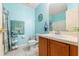 Cozy bathroom with blue accents, wood vanity, and decorative nautical elements at 7102 W Creek Dr, Tampa, FL 33615