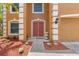 Inviting entryway with a double door and decorative landscaping enhancing curb appeal at 7102 W Creek Dr, Tampa, FL 33615