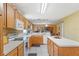 Functional kitchen featuring a center island and essential appliances at 7102 W Creek Dr, Tampa, FL 33615