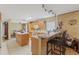 Open kitchen with a breakfast bar, practical appliances, and ample counter space for meal preparation at 7102 W Creek Dr, Tampa, FL 33615