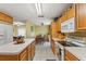 Bright kitchen with a microwave, stove, and direct access to an adjacent dining area at 7102 W Creek Dr, Tampa, FL 33615