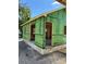 A partially constructed home shows framing and wall sheathing with window and door openings at 812 W Braddock St, Tampa, FL 33603