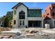 View of the new home's exterior showcasing stucco and siding on a sunny day at 812 W Braddock St, Tampa, FL 33603