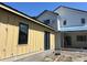 Exterior view showing modern siding, black framed windows and doors, and new home construction at 812 W Braddock St, Tampa, FL 33603