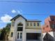 New construction with modern design, gray accents, large windows, and an attached two-car garage at 812 W Braddock St, Tampa, FL 33603