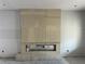Unfinished living room featuring a modern fireplace with stone and an opening for the gas insert at 812 W Braddock St, Tampa, FL 33603