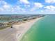 Expansive aerial view of the beach, turquoise water, and waterfront properties in St. Pete, Florida at 844 67Th S St, South Pasadena, FL 33707
