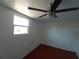 Cozy bedroom features a modern ceiling fan and a bright window at 844 67Th S St, South Pasadena, FL 33707