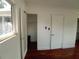 Bright bedroom featuring hardwood floors, neutral walls, closet, and natural light from the window at 844 67Th S St, South Pasadena, FL 33707