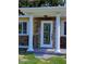 Charming front entrance with decorative pillars and glass door at 844 67Th S St, South Pasadena, FL 33707