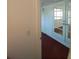 Hallway with white walls and red carpet and a view to a room with glass doors and windows at 844 67Th S St, South Pasadena, FL 33707