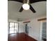 Spacious living room with hardwood floors, ceiling fans, and access to a sunroom at 844 67Th S St, South Pasadena, FL 33707