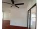 Bright living room featuring a modern ceiling fan, hardwood floors, and minimalist design at 844 67Th S St, South Pasadena, FL 33707