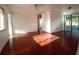 Open living room with wood floors and natural light at 844 67Th S St, South Pasadena, FL 33707