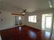 Bright living room with hardwood floors, natural light, and access to an exterior door at 844 67Th S St, South Pasadena, FL 33707
