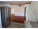 Open living space featuring hardwood floors and a modern kitchen with stainless refrigerator at 844 67Th S St, South Pasadena, FL 33707