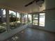 Enclosed patio with tile flooring, ceiling fan, and backyard views at 844 67Th S St, South Pasadena, FL 33707