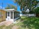 Exterior shot of the cozy sunroom with screened windows at 844 67Th S St, South Pasadena, FL 33707