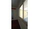 Cozy sunroom featuring an exterior window with hardwood floors and natural light at 844 67Th S St, South Pasadena, FL 33707