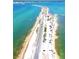 Beautiful aerial view of Honeymoon Island State Park featuring a long road and clear turquoise waters at 854 Sky Loch N Dr, Dunedin, FL 34698