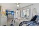 Bedroom with en-suite bathroom, and screened in porch area at 854 Sky Loch N Dr, Dunedin, FL 34698