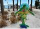 Decorated dolphin statue with bright colorful designs in Dunedin near the shore at 854 Sky Loch N Dr, Dunedin, FL 34698