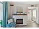 Inviting fireplace in living room with decorative mantel and adjacent seating area at 854 Sky Loch N Dr, Dunedin, FL 34698