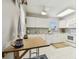 Bright kitchen with modern appliances, tile backsplash, and eat in breakfast table at 854 Sky Loch N Dr, Dunedin, FL 34698