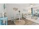 Open living area with dining space, comfortable seating, and coastal decor at 854 Sky Loch N Dr, Dunedin, FL 34698