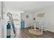 Inviting living area with wood floors, casual dining, and coastal decor at 854 Sky Loch N Dr, Dunedin, FL 34698