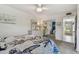 Bright main bedroom with ceiling fan, large closet, and decorative furniture and bedding at 854 Sky Loch N Dr, Dunedin, FL 34698