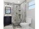 Updated bathroom featuring a stylish vanity, tiled shower, and modern fixtures at 8648 78Th Pl, Seminole, FL 33777
