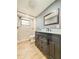 Bathroom featuring white subway tile shower and a vanity with marble countertop at 8648 78Th Pl, Seminole, FL 33777