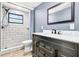 Modern bathroom featuring a tiled shower and a sleek vanity with great finishes at 8648 78Th Pl, Seminole, FL 33777
