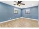 Bright bedroom with wood floors and two windows for ample natural light at 8648 78Th Pl, Seminole, FL 33777