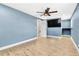 Spacious bedroom featuring wood floors, ceiling fan, and modern fixtures at 8648 78Th Pl, Seminole, FL 33777