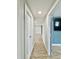 Hallway with wood-look flooring leading to various rooms in the home at 8648 78Th Pl, Seminole, FL 33777