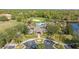 An aerial view of the community pool, clubhouse, and surrounding green space at 5754 Sweet William Ter, Land O Lakes, FL 34639