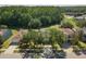 Stunning aerial view of the community and surrounding lush trees at 5754 Sweet William Ter, Land O Lakes, FL 34639