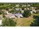 Beautiful aerial view of home featuring a screened-in patio and lush green lawn at 5754 Sweet William Ter, Land O Lakes, FL 34639