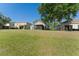 Expansive backyard featuring a screened-in patio, perfect for outdoor enjoyment and entertaining at 5754 Sweet William Ter, Land O Lakes, FL 34639