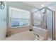 Relaxing bathroom with tub, shower, and a serene ambiance at 5754 Sweet William Ter, Land O Lakes, FL 34639