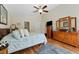 Spacious bedroom with hardwood floors, ceiling fan, and plenty of storage at 5754 Sweet William Ter, Land O Lakes, FL 34639