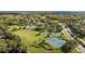 Aerial view of community amenities including a pool, sports courts, and a playground at 5754 Sweet William Ter, Land O Lakes, FL 34639